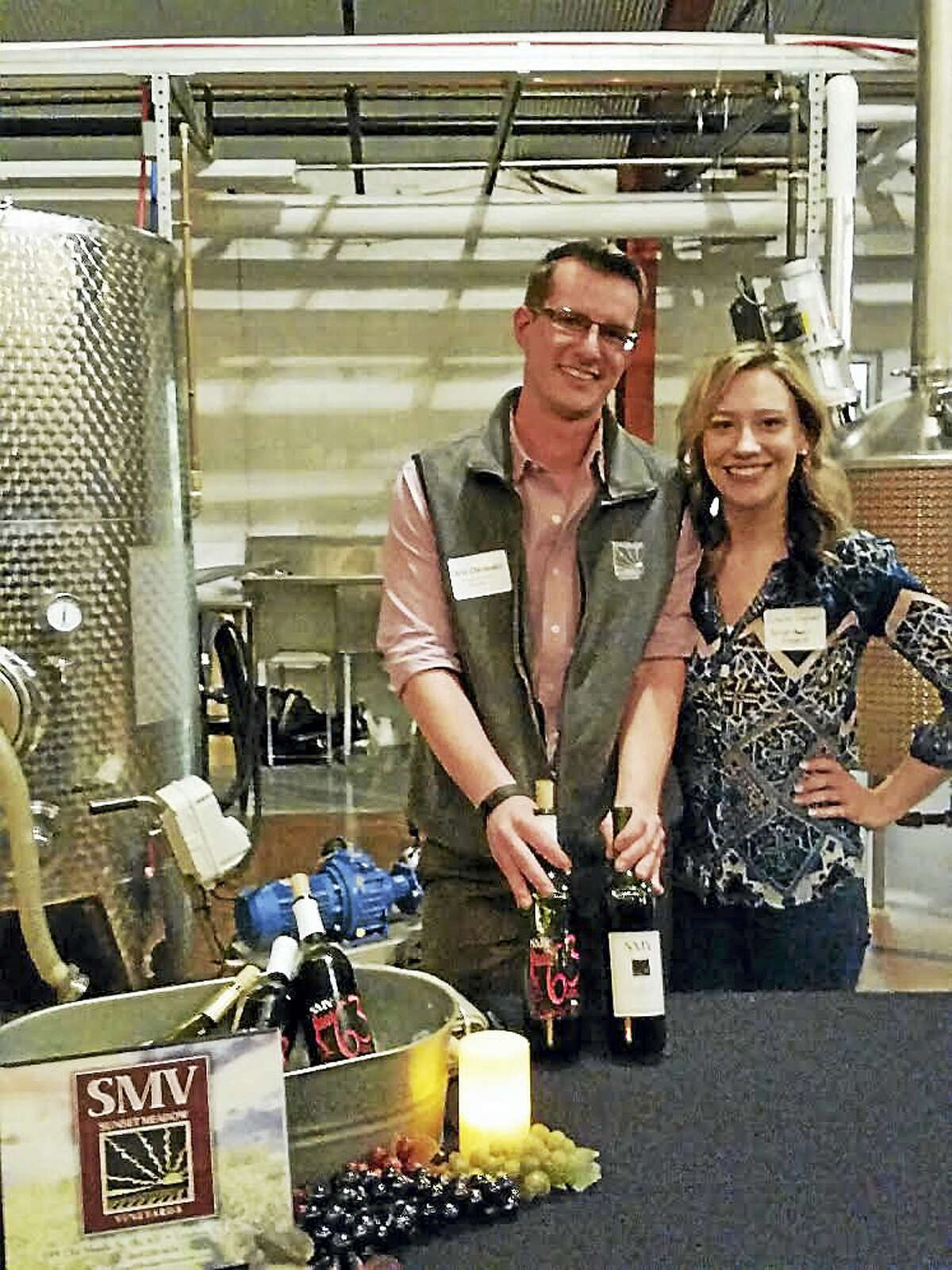 Christopher Chichester and Emilia Jaguera of Sunset Meadow Vineyards of Goshen introduced about 100 visitors to their vintages at culture blog Unlocking Litchfield’s “First Birthday” party at Litchfield Distillery ,at 569 Bantam Rd., in Litchfield on Saturday evening. Activities included speeches from Ross as well as the 2003-season “American Idol” contestant Kimberley Locke and etiquette lecturer Karen Thomas of Torrington. Photo by Noel Ambery