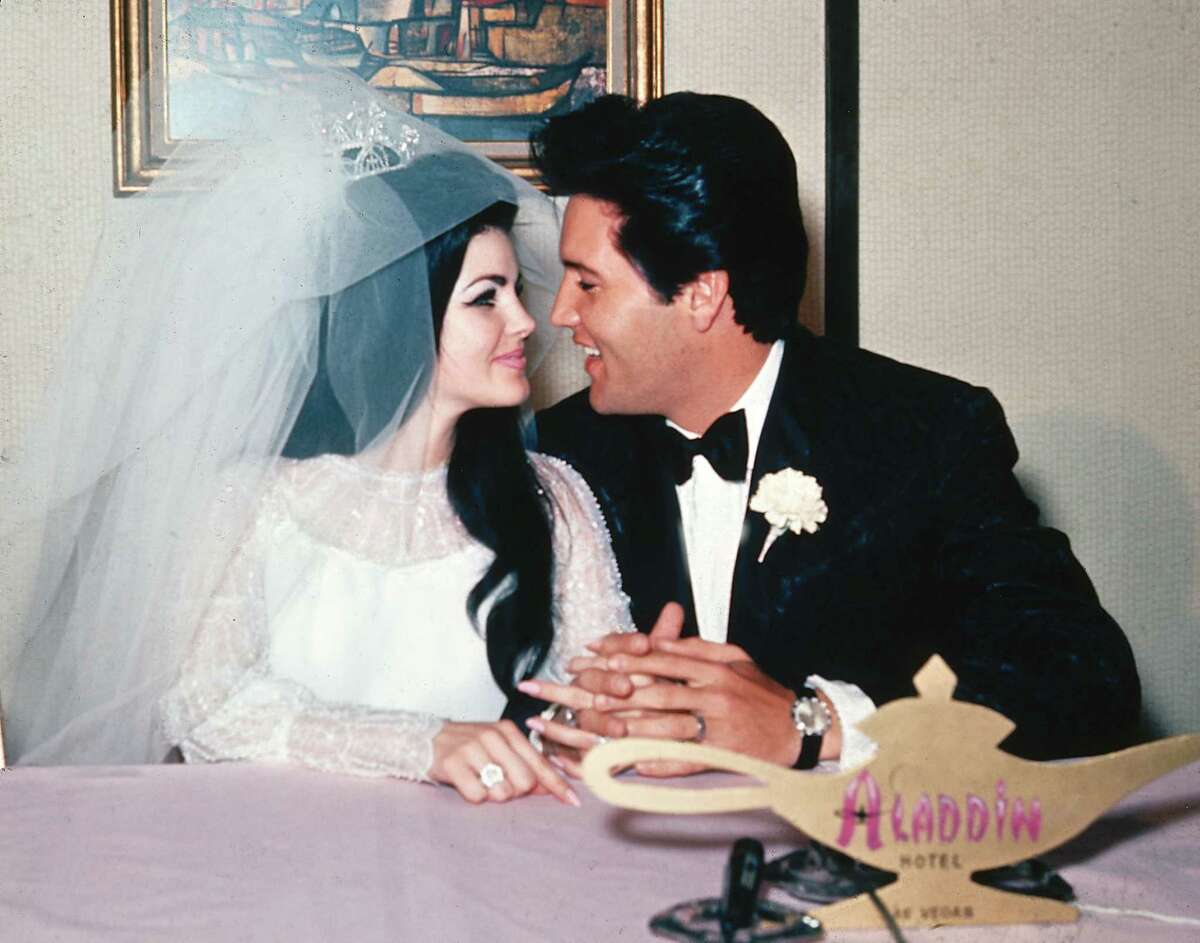 In this May 1, 1967 photo, singer Elvis Presley and his bride, the former Priscilla Beaulieu, appear at the Aladdin Hotel in Las Vegas, after their wedding.