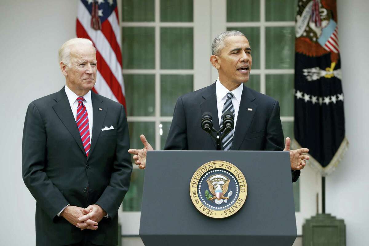 President Barack Obama, accompanied by Vice President Joe Biden, speaks in the election on Wednesday, Nov. 9, 2016 in the Rose Garden of the White House in Washington.