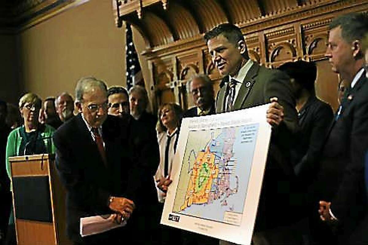 Mohegan Tribal Chairman Kevin Brown holds a map of MGM’s market for its Springfield casino