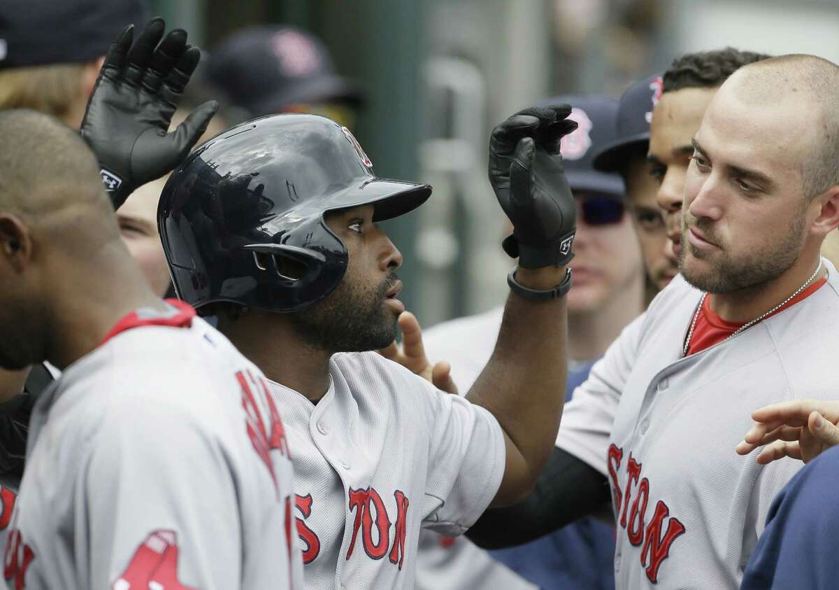Red Sox outfielder Jackie Bradley Jr. is congratulated by teammates after his solo home run during the seventh inning of Boston’s 7-2 win over the Tigers on Sunday in Detroit.