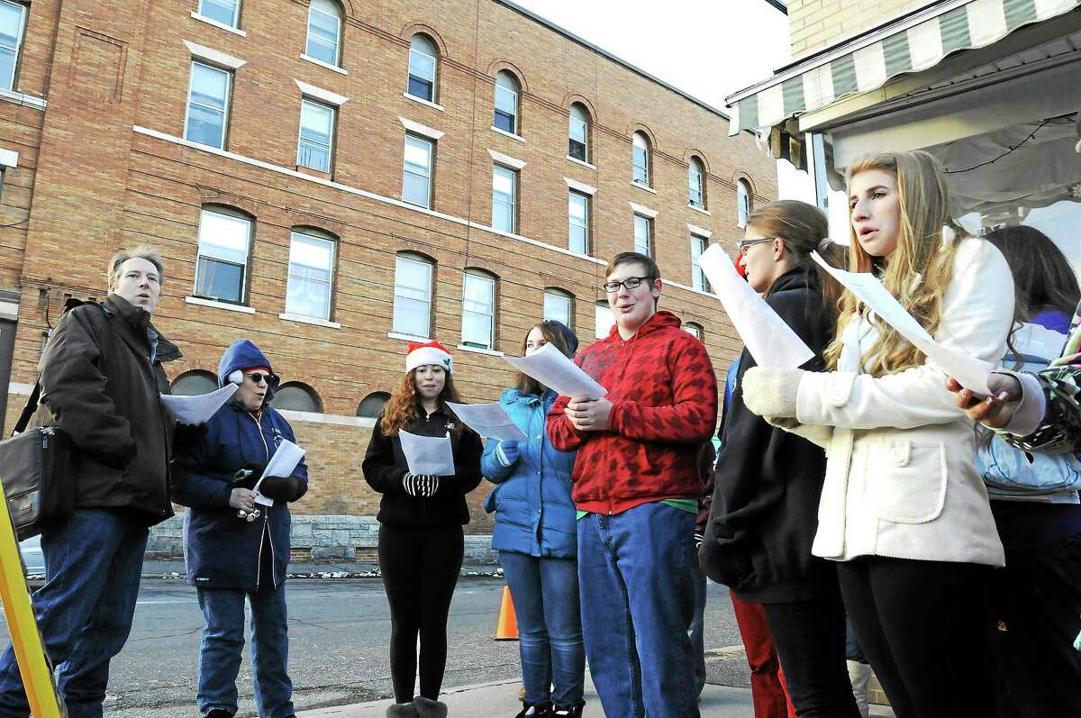 The Gilbert School Chorus sings carols during Winsted’s Christmas on Main Street event in 2013.