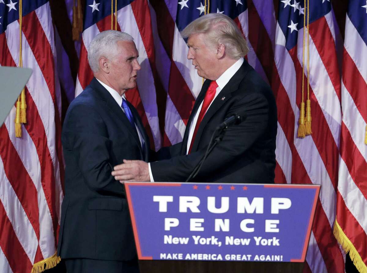 President-elect Donald Trump, right, shakes hands with Vice-President-elect Mike Pence during his election night rally, Wednesday, Nov. 9, 2016, in New York.