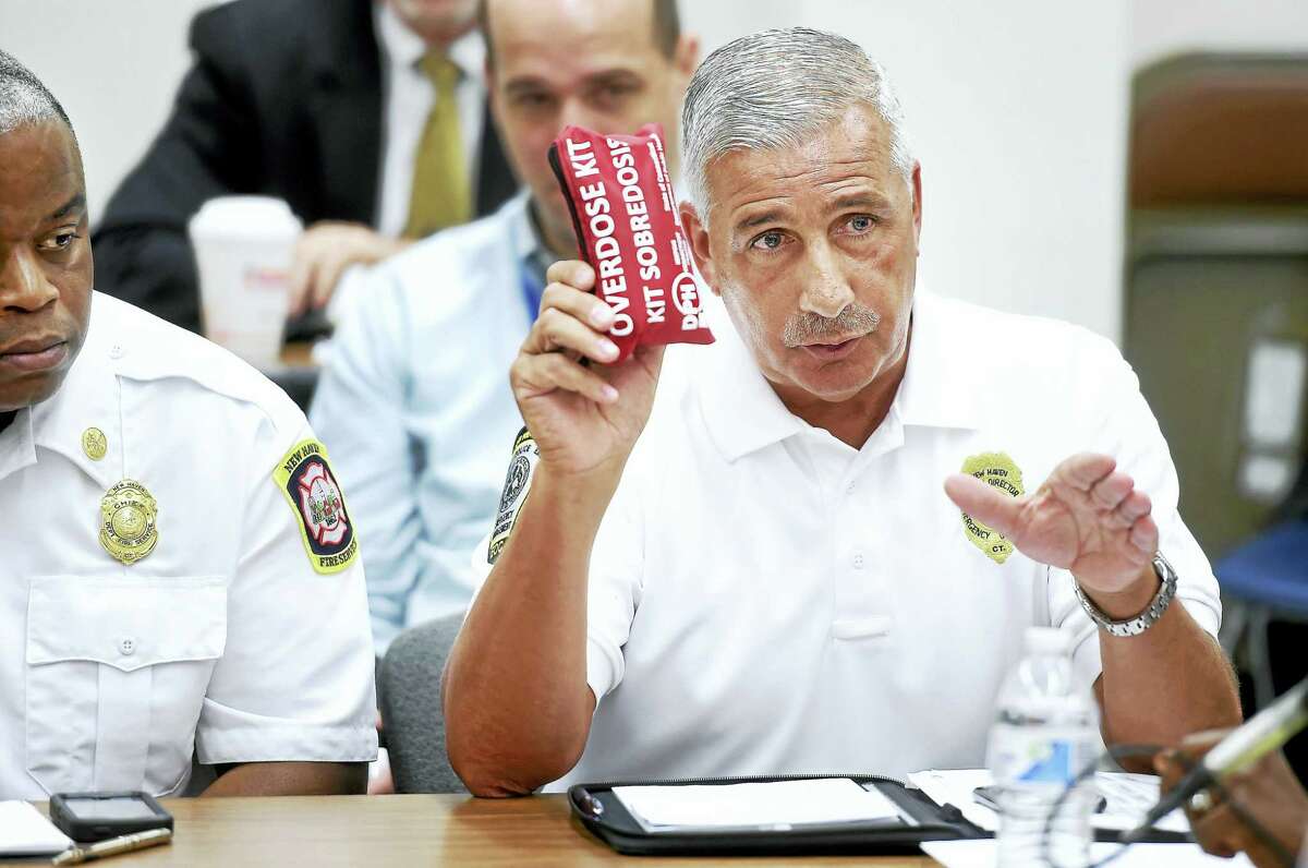 Rick Fontana, deputy director of emergency operations at the city Office of Emergency Management and Homeland Security, holds up an overdose kit while making a point at a roundtable discussion about efforts to curb the opioid epidemic at the New Haven Police Department on Friday.
