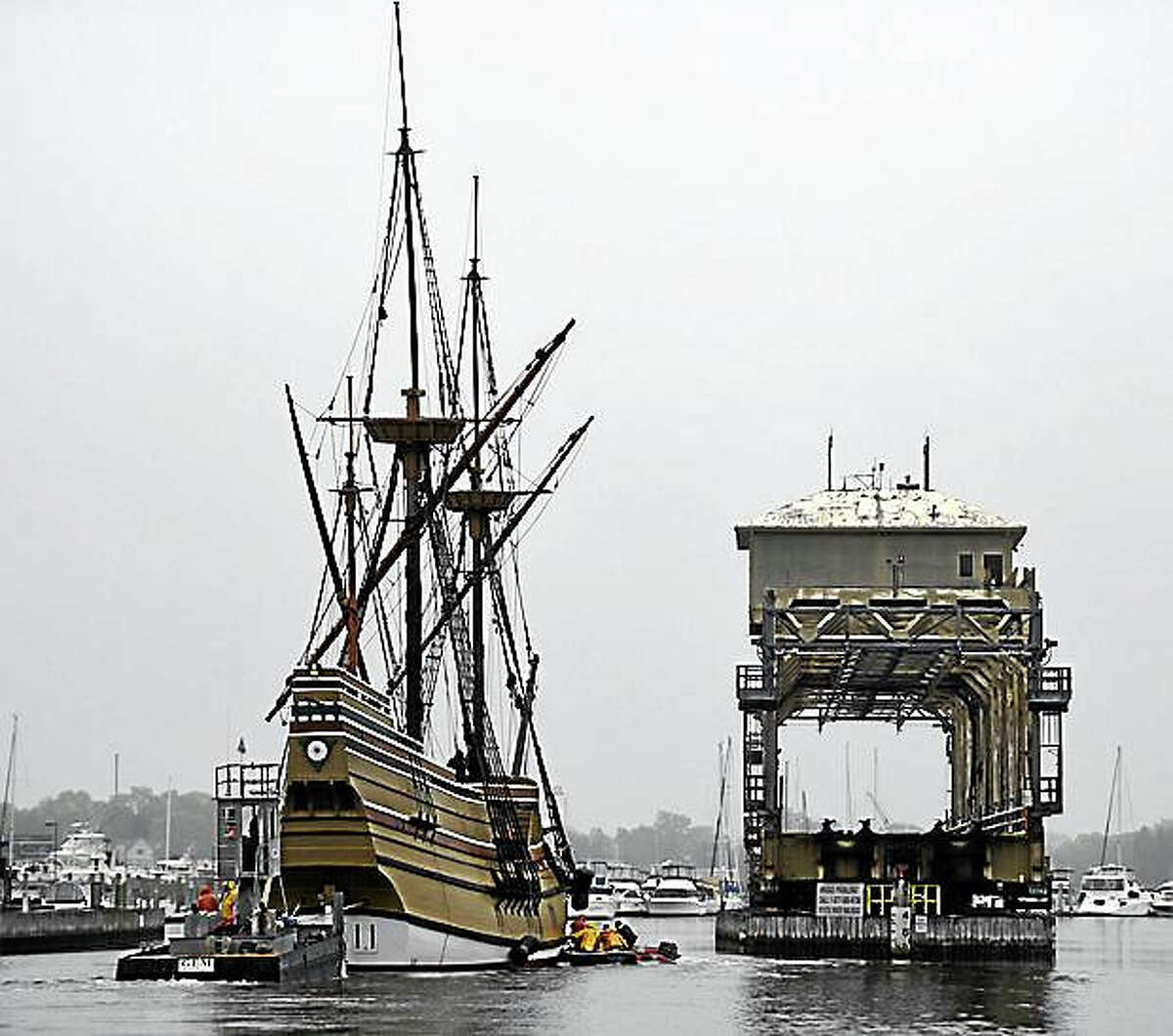 Mayflower II being towed in the Mystic River, past the Mystic River Bridge