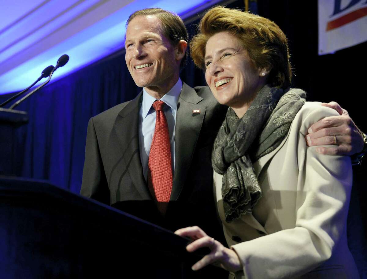 U.S. Sen. Richard Blumenthal, D-Conn., accompanied by his wife, Cynthia, addresses supporters at an election night rally celebrating his victory Tuesday in Hartford.