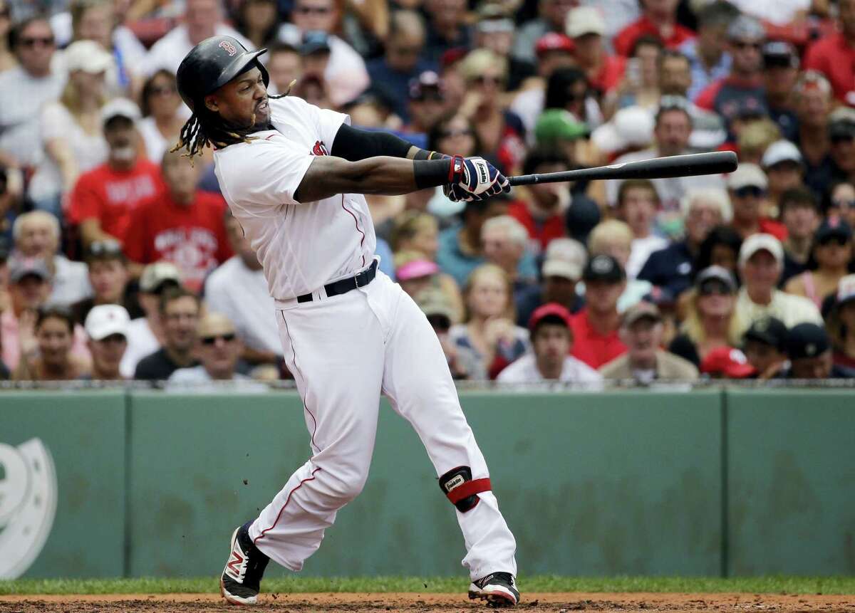 Boston’s Hanley Ramirez hits a grand slam in the fifth inning against the Tampa Bay Rays at Fenway Park Wednesday. The Red Sox held on to beat the Rays 8-6.