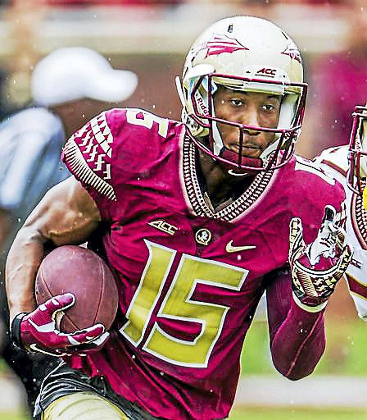 In this April 11, 2015, file photo, Florida State wide receiver Travis Rudolph run in the first half of the Florida State Garnet & Gold spring college football game in Tallahassee, Fla. A small gesture of kindness by Florida State University wide receiver Travis Rudolph — captured in a photo and shared on Facebook — had tears streaming down the face of the sixth-grader’s mother, Leah Paske. “I’m not sure what exactly made this incredibly kind man share a lunch table with my son, but I’m happy to say it will not soon be forgotten,” she wrote.