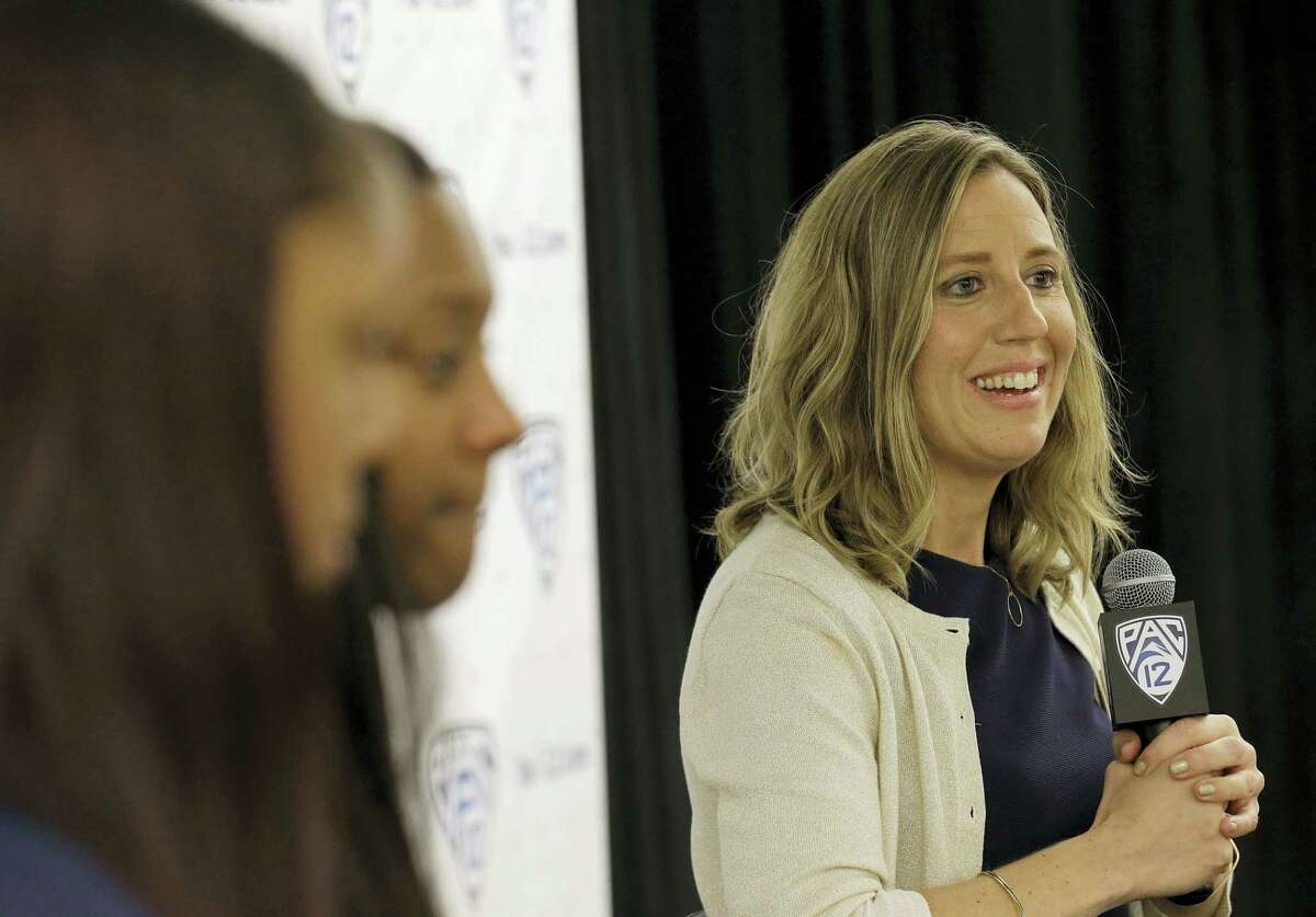 California head coach Lindsay Gottlieb, right, speaks during the Pac-12 NCAA college basketball media day.