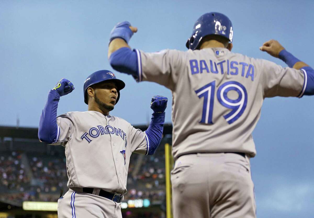 Blue Jays sluggers Edwin Encarnacion, left, and Jose Bautista were among 10 players to receive $17.2 million qualifying offers from their teams on Monday.