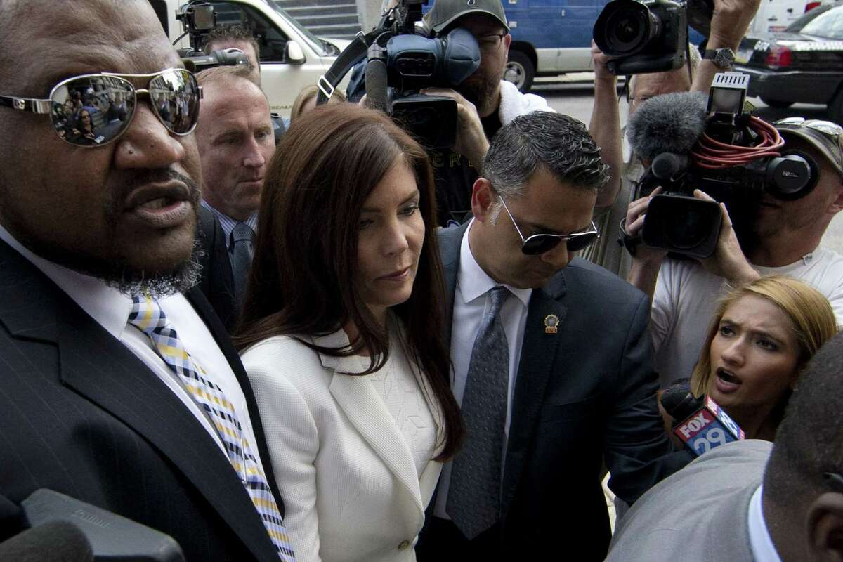 Pennsylvania Attorney General Kathleen Kane arrives Saturday, Aug. 8, 2015, to be processed and arraigned on charges she leaked secret grand jury material and then lied about it under oath at the Montgomery County detective bureau in Norristown, Pa. Kane, the state’s first elected female attorney general, vows to fight the charges, which include perjury, obstruction and conspiracy.