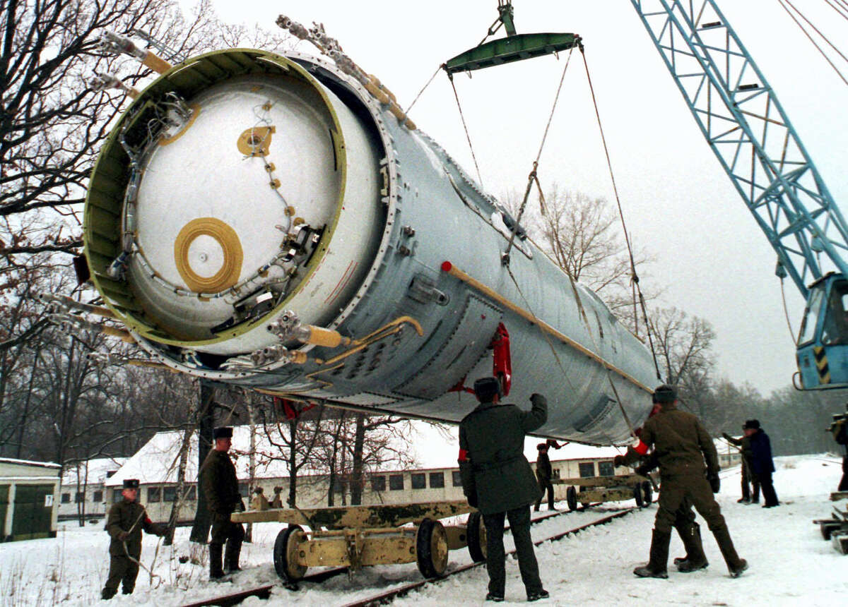 In this Dec. 24, 1997, photo, soldiers prepare to destroy a ballistic SS-19 missile in the yard of the largest former Soviet military rocket base in Vakulenchuk, Ukraine.
