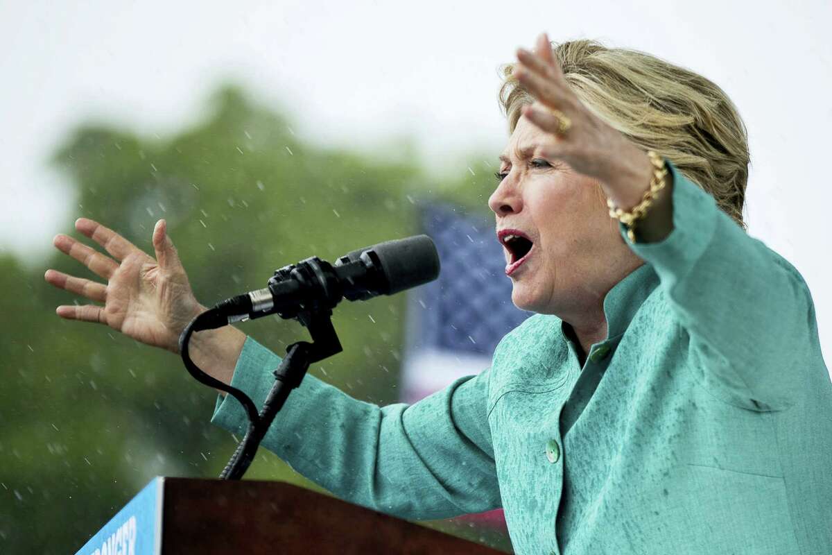 Democratic presidential candidate Hillary Clinton speaks during a heavy rain at a rally at C.B. Smith Park in Pembroke Pines, Fla., Nov. 5..