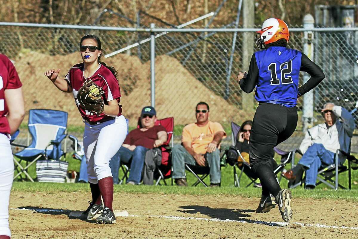 Photo by Marianne KillackeyCrosby's Nayarit Cora runs out a pop-up while Torrington first baseman Amanda Thiel watches the play in Torrington's mercy-rule-shortened win Friday.