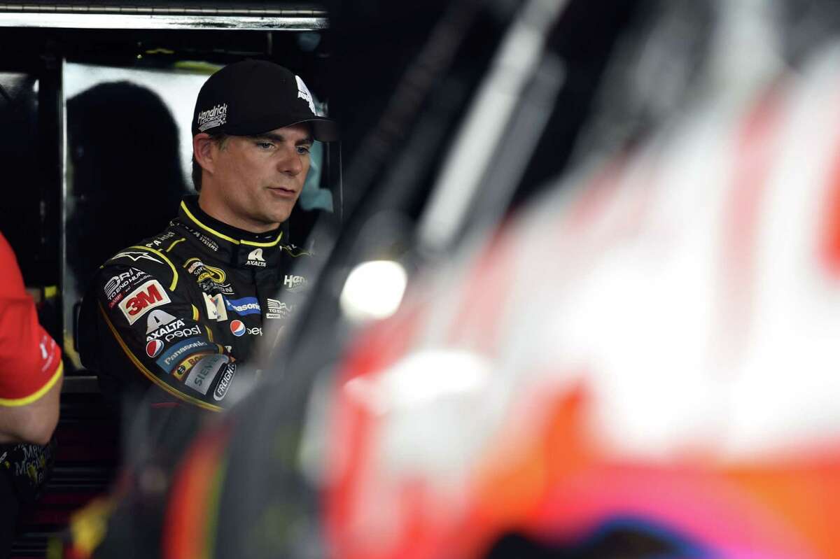 Jeff Gordon stands in the garage area during practice for Sunday’s NASCAR Sprint Cup series auto race at Watkins Glen International on Friday in Watkins Glen, N.Y.