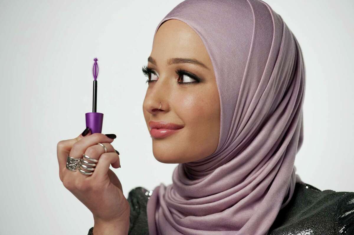 In this undated photo provided by CoverGirl, beauty blogger Nura Afia poses for a photo. CoverGirl is featuring a woman wearing a hijab in its advertising for the first time in the makeup line’s history.