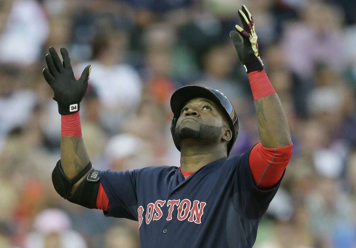 Red Sox designated hitter David Ortiz looks skyward after reaching home plate on his two-run home run on Friday.