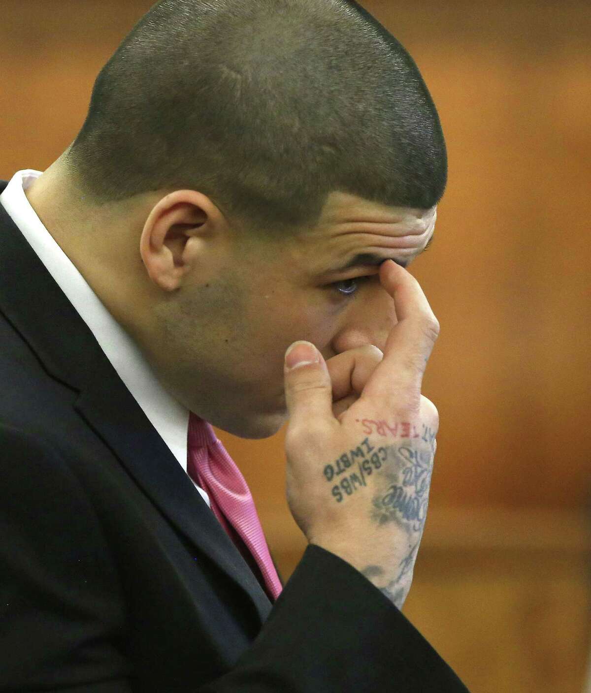 Former New England Patriots NFL football player Aaron Hernandez is seated during his murder trial, Thursday, April 2, 2015, in Fall River, Mass. Hernandez is charged with killing Odin Lloyd.