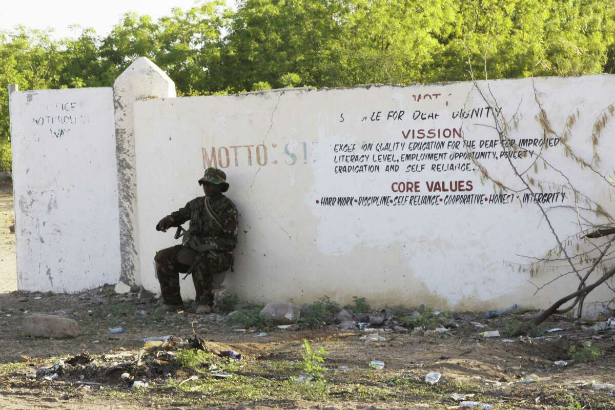Associated PressA Kenya Defence Forces soldier secures the area around the Garissa University college, in Garissa, Kenya, Thursday.