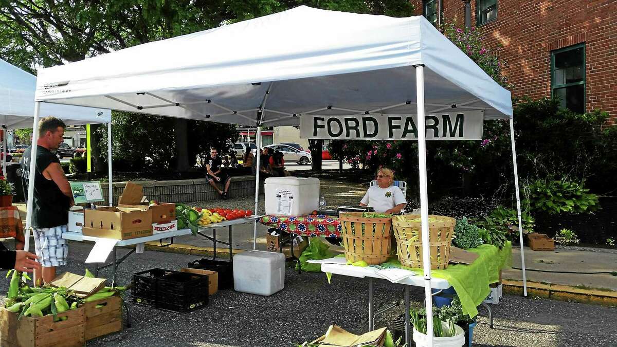 Carol Kranyik, of Ford Farm, sits at her booth during this past Thursday’s Marketplace on Franklin Avenue.