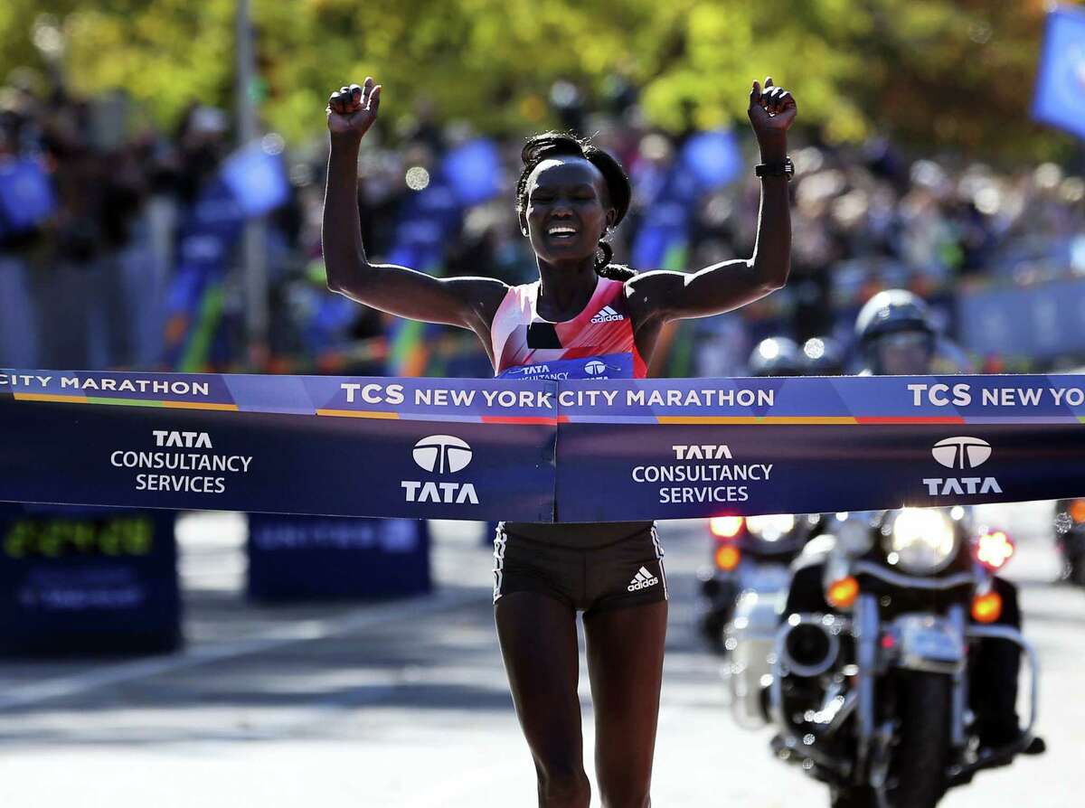 Mary Keitany of Kenya crosses the finish line first in the women’s division of the 2016 New York City Marathon in New York on Nov. 6, 2016.