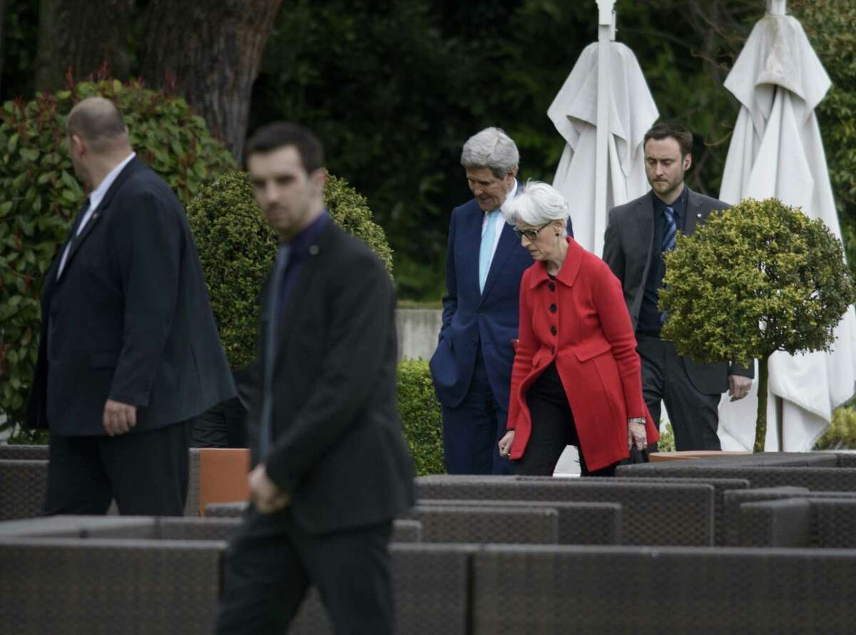 U.S. Secretary of State John Kerry, center and US Under Secretary for Political Affairs Wendy Sherman, centre right, as they walk in a courtyard, at the Beau Rivage Palace Hotel, during an extended round of talks on Iran’s nuclear program on April 2, 2015, in Lausanne, Switzerland.