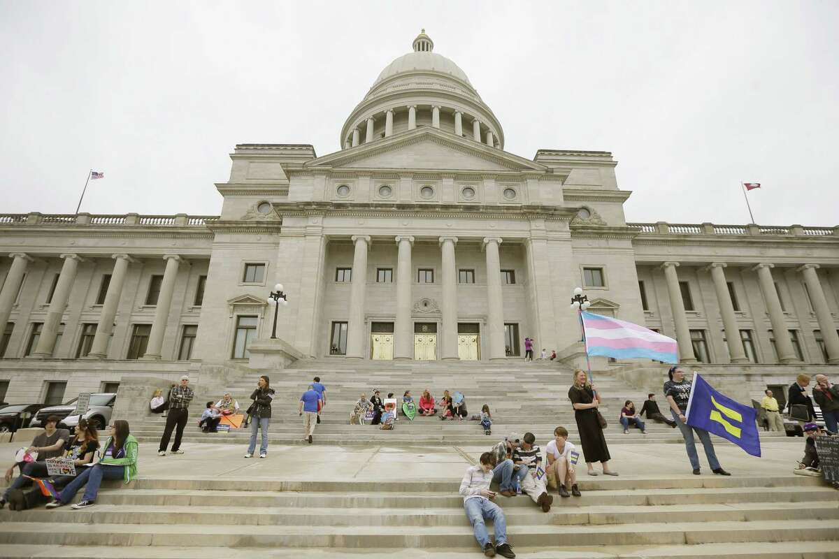 Opponents of a religious freedom bill gather at the Arkansas state Capitol in Little Rock, Ark., Thursday, April 2, 2015. The measure later passed in the Arkansas House and was signed into law.
