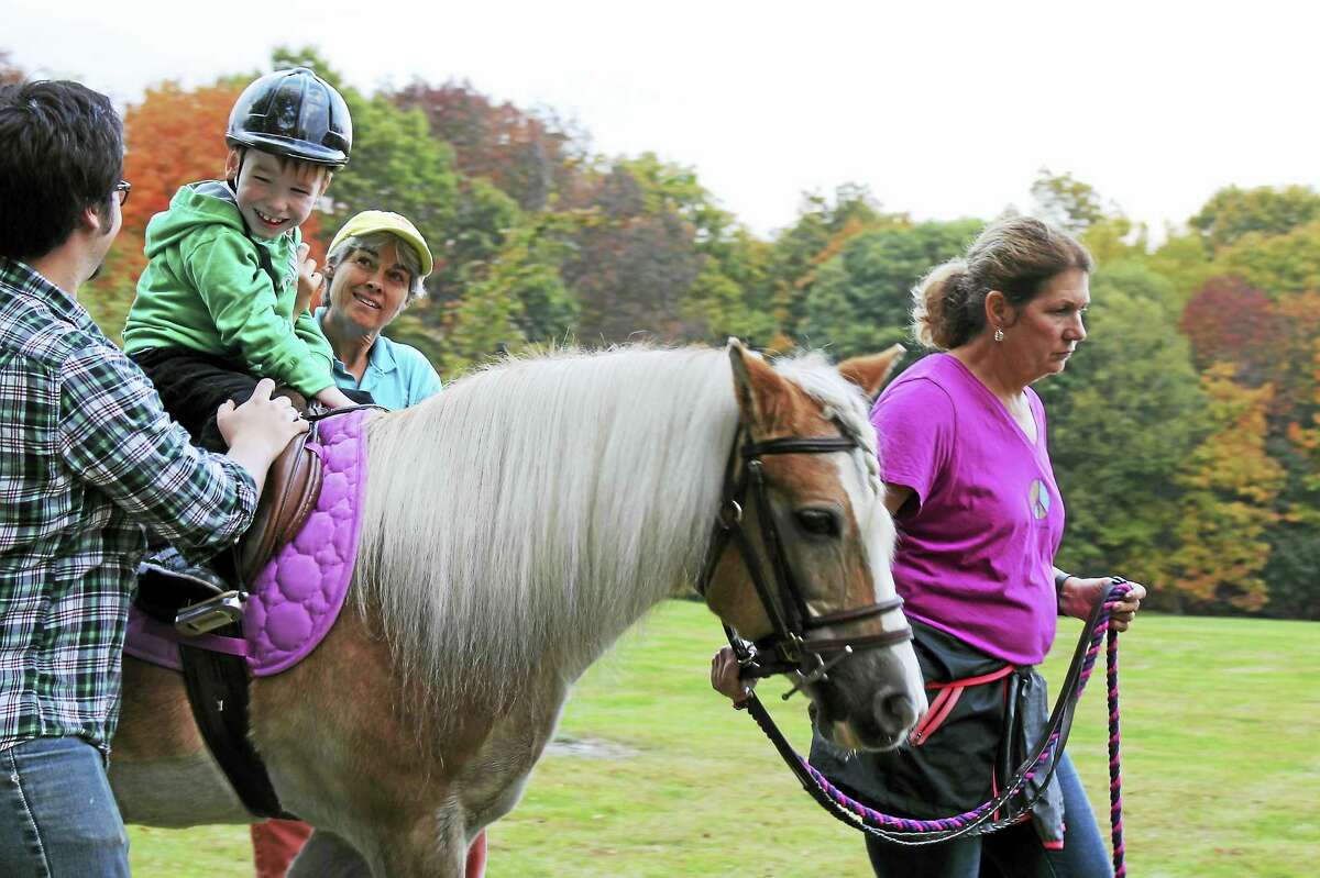 Contributed photo Little Britches provides therapeutic riding lessons to children with disabilities. Volunteers are needed to assist riders for the fall program, which begins Sept. 7.