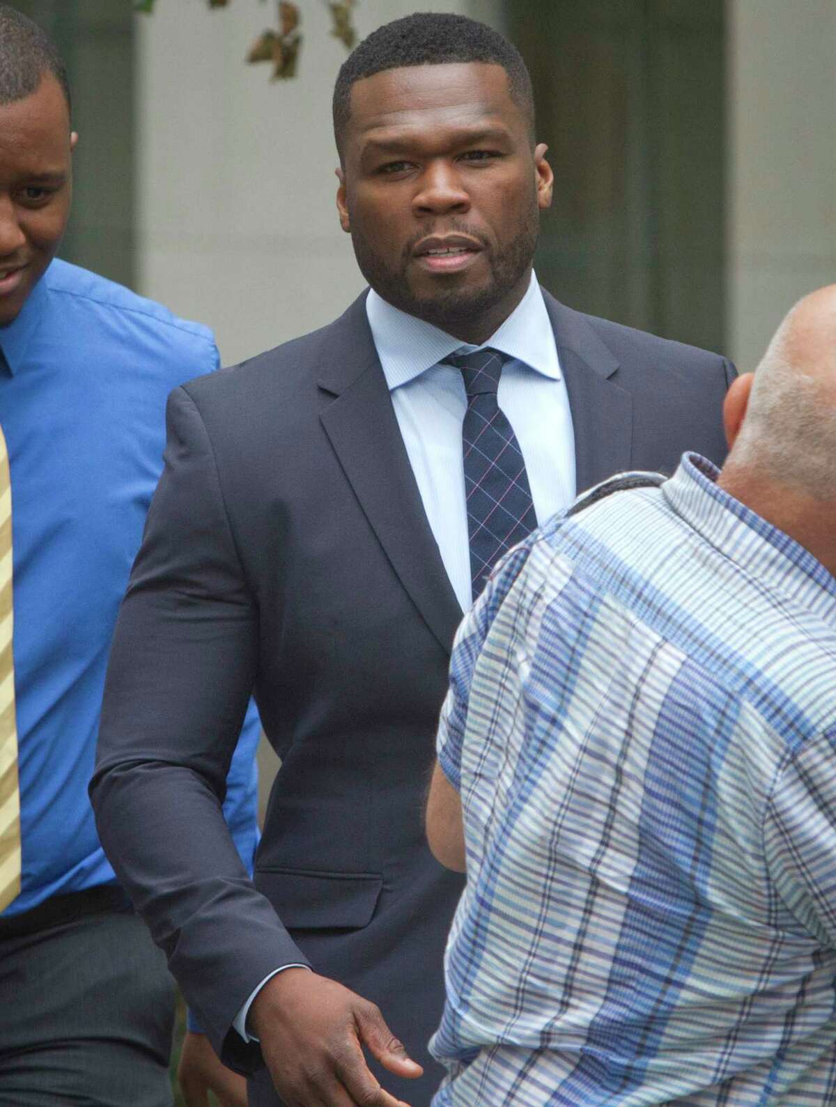 In this July 21, 2015 photo, rapper Curtis Jackson, also known as 50 Cent, leaves court after testifying in front of the jury about his finances, his business deals and the media attention surrounding his recent bankruptcy filing, in New York.