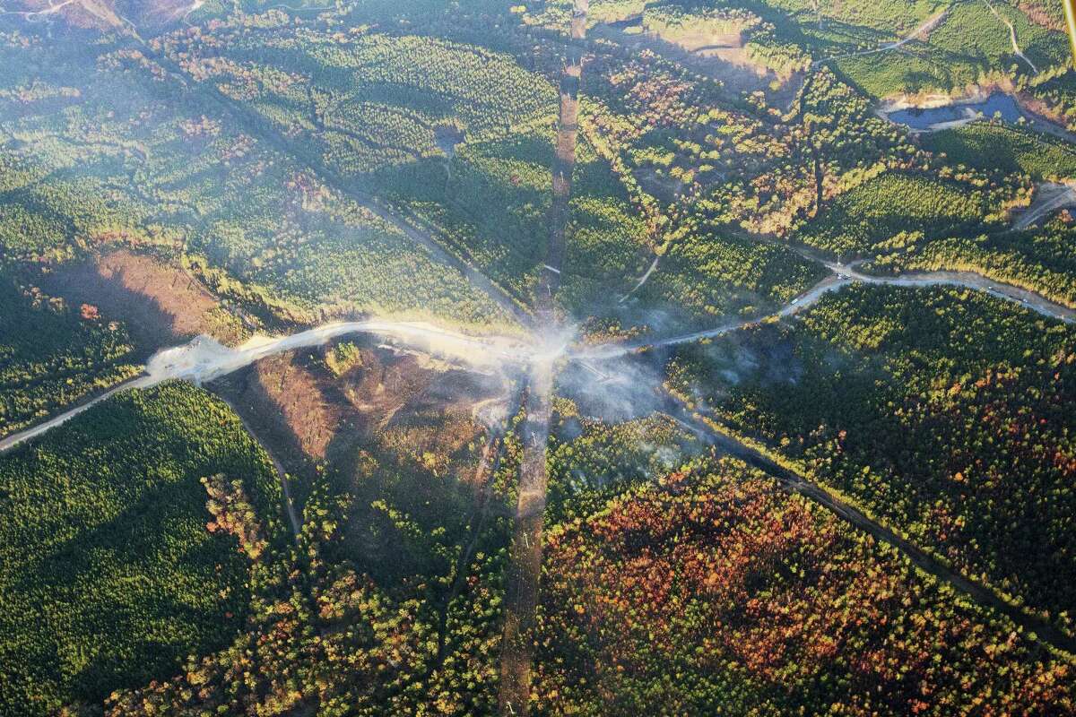 A fog of smoke covers the trees near an explosion of a Colonial Pipeline on Nov. 1, 2016 in Helena, Ala. The pipeline explosion occurred on Monday. The blast, which sent flames and thick black smoke soaring over the forest, happened about a mile west of where the pipeline ruptured in September, Gov. Robert Bentley said in a statement.