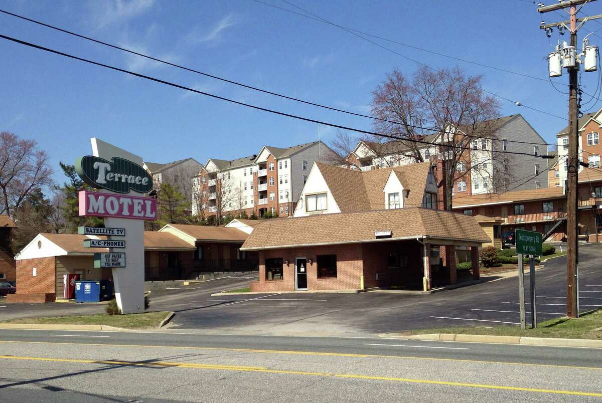 The entrance to the Terrace Motel sits empty on Tuesday, March 31, 2015 in Elkridge, Md. Police say two cross-dressing men who crashed into a guarded entrance to the National Security Agency on Monday in a stolen car, met the vehicle's owner in Baltimore before heading to the motel to "party." (AP Photo/Meredith Somers)