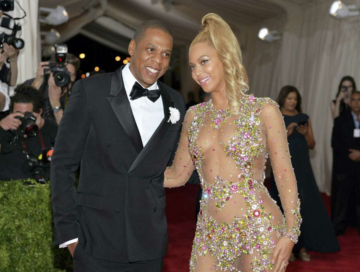 In this May 4, 2015 photo, Jay Z, left, and Beyonce arrive at The Metropolitan Museum of Art’s Costume Institute benefit gala celebrating “China: Through the Looking Glass” in New York. The couple dressed as Barbie and Ken for Halloween in photos posted on Instagram Nov. 1, 2016.