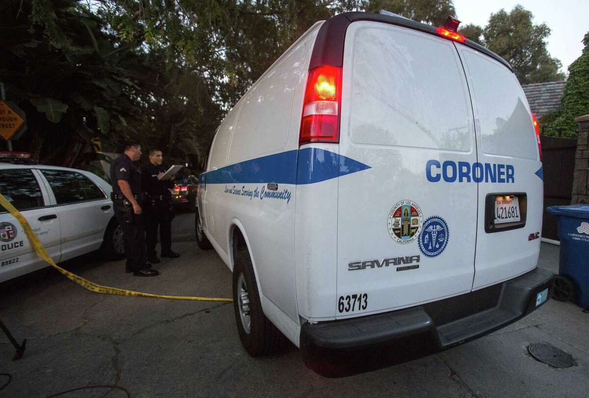A Los Angeles County Coroner van arrives at a home in the Hollywood Hills area of Los Angeles, Tuesday, March 31, 2015. Police say a man was found dead at the home of Andrew Getty, heir to Getty oil fortune. (AP Photo/Ringo H.W. Chiu)