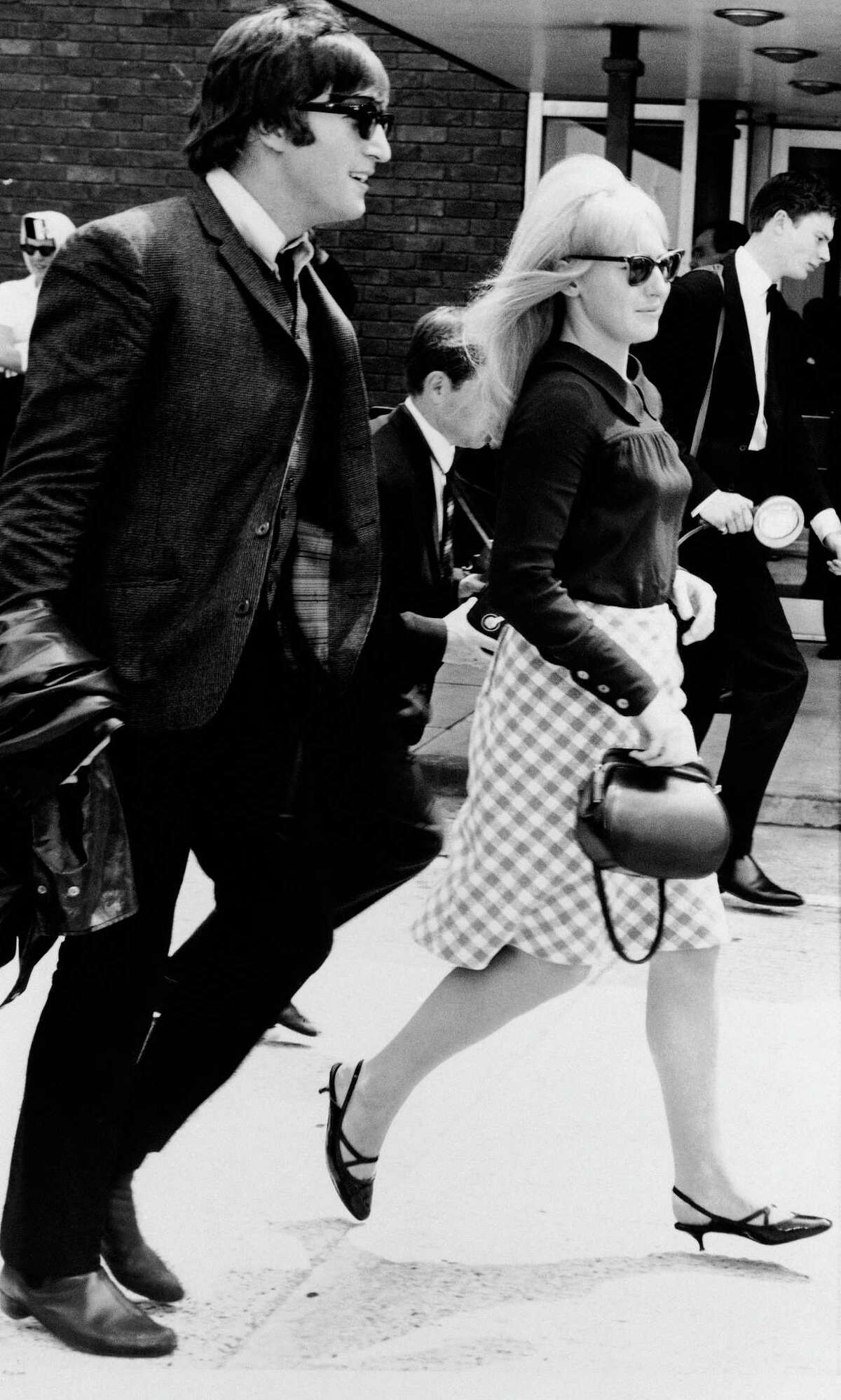 File- In this July 2,1964 file photo, singer John Lennon and his then wife, Cynthia, at Luton airport after 'The Beatles' arrived home from their three-week tour of Australia and New Zealand. Cynthia Lennon passed away on Thursday, April 1, 2015, aged 75, at her home in Mallorca, Spain, following a short but brave battle with cancer. (AP Photo/Victor Boynton, File)