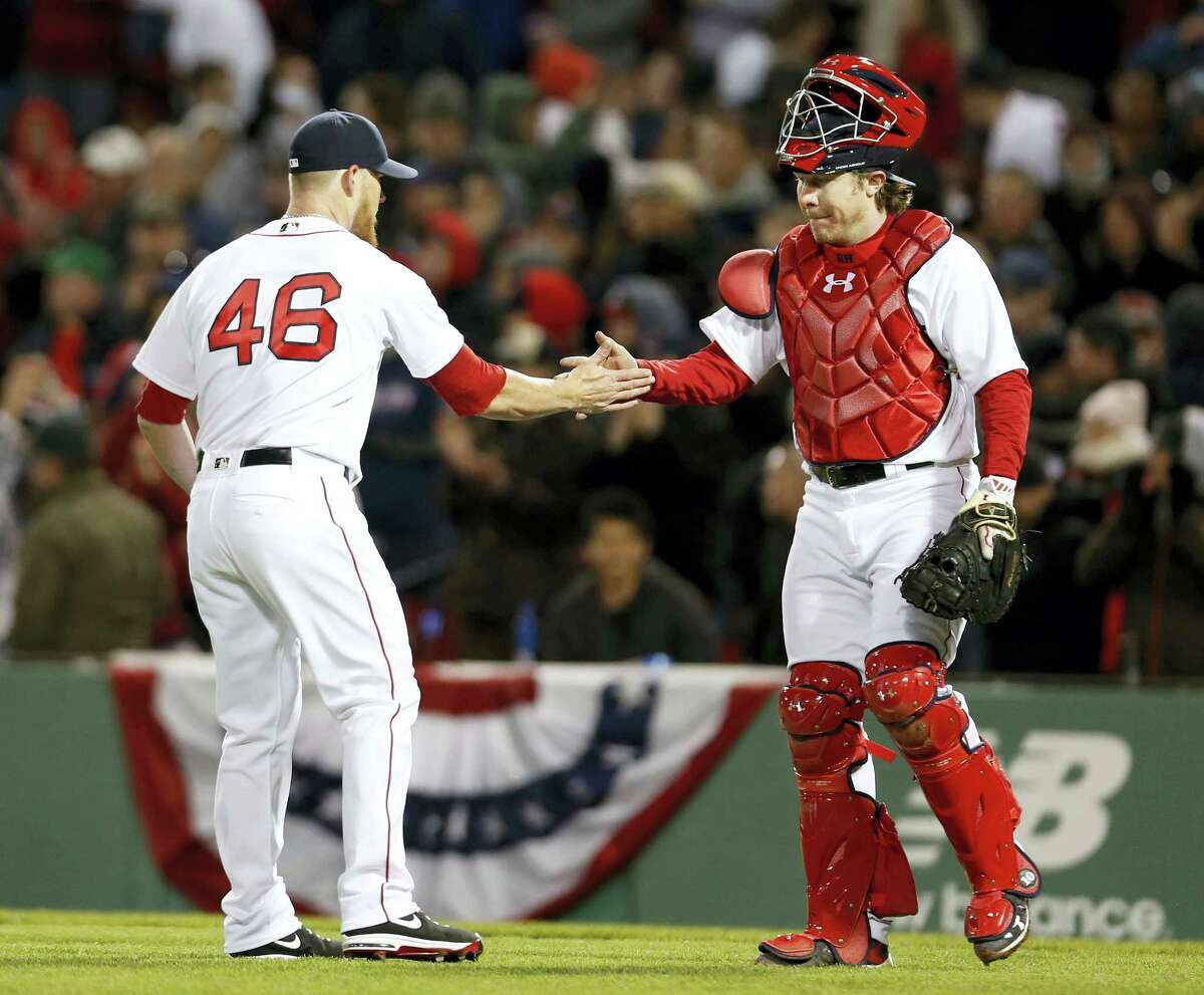 Red Sox catcher Ryan Hanigan congratulates closer Craig Kimbrel after Boston’s 4-2 win over the Orioles.