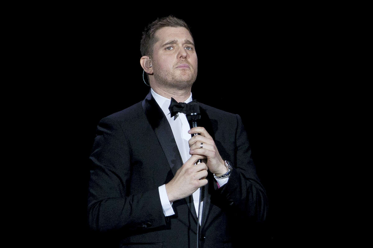 In this Jan. 31, 2014, file photo, Canadian singer Michael Buble performs during his concert at Palacio de los Deportes in Madrid, Spain. Buble announced on Nov. 4, 2016, that his 3-year-old son has been diagnosed with cancer and is undergoing treatment in the U.S.