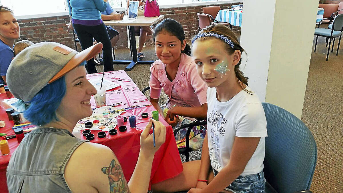 N.F. Ambery photo Abby Foulds, 10, of Torrington gets her face painted.