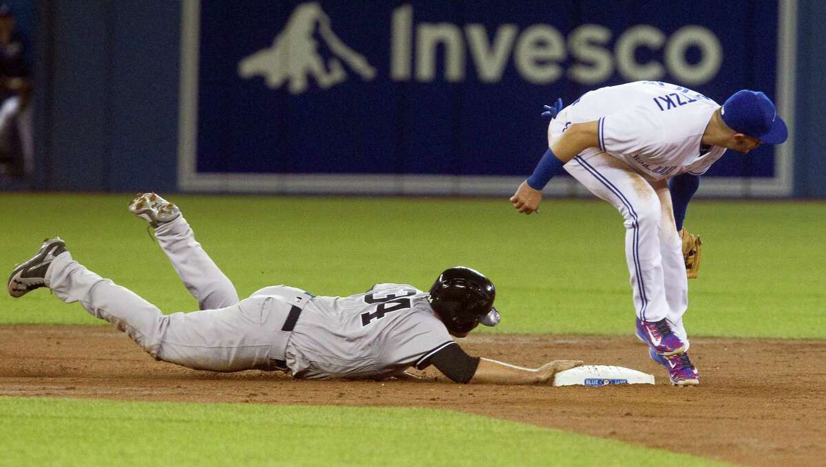 Brian McCann dives back to second base on a pick-off throw on Tuesday.