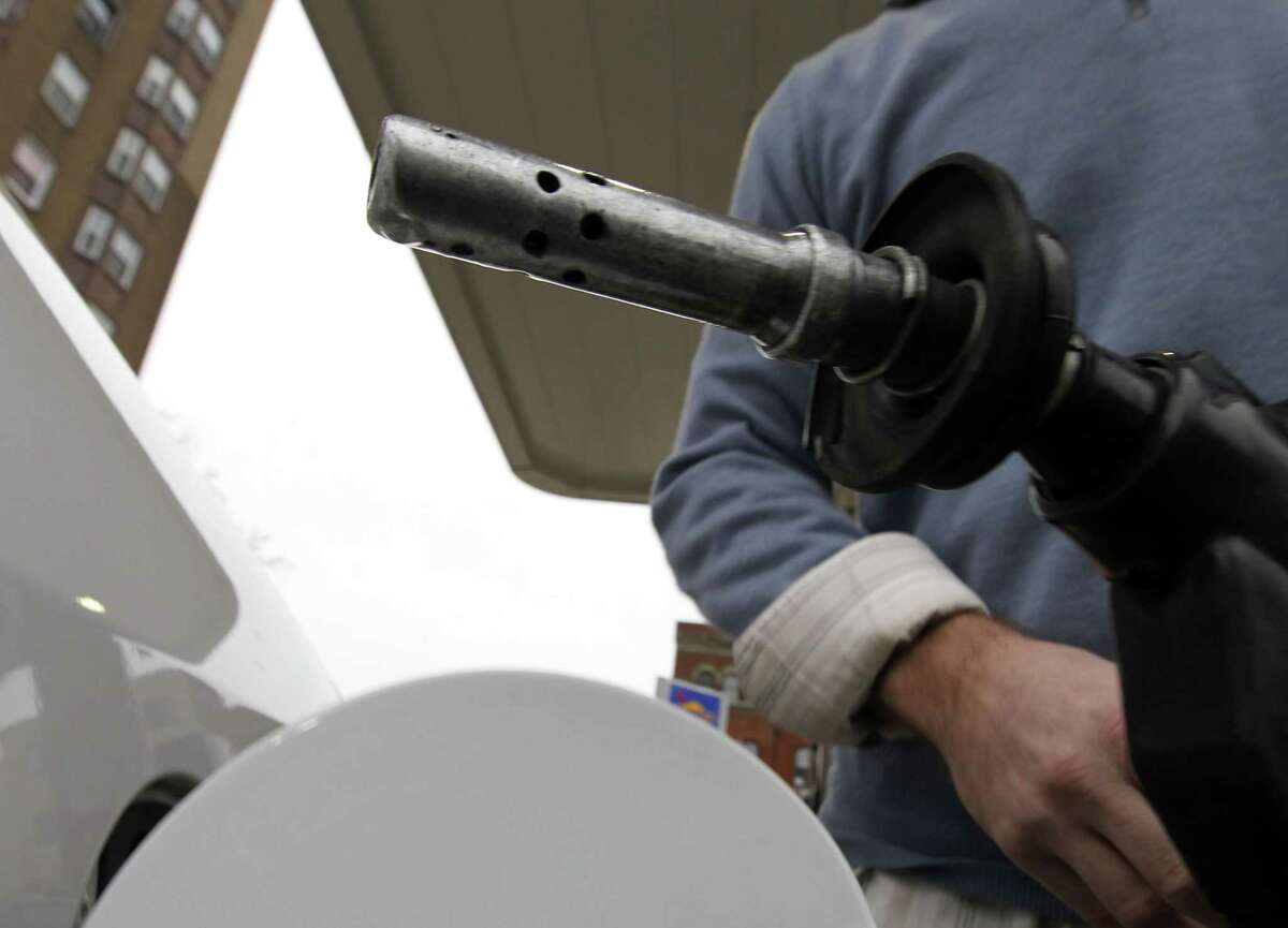 A drop of fuel hangs from the tip of a gas nozzle in Philadelphia in this 2012 file photo.