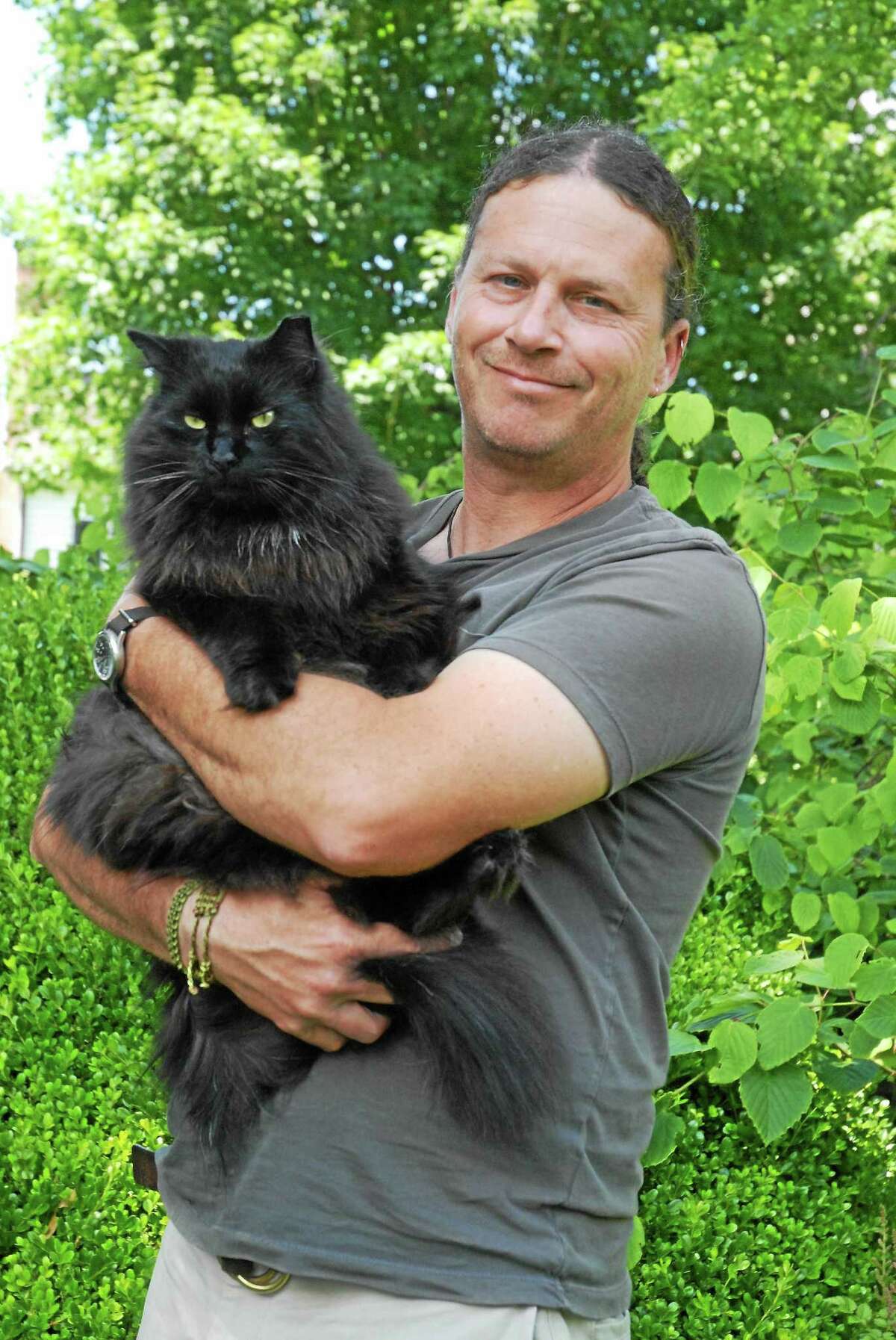 Rob Girard with Leo, the rescue garden cat.