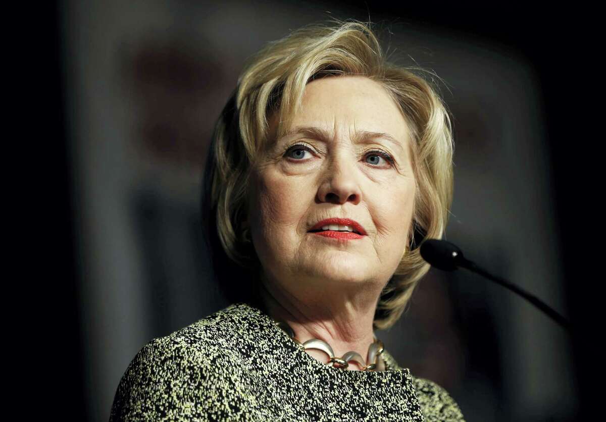 In this April 6, 2016 photo, Democratic presidential candidate Hillary Clinton speaks at the Pennsylvania AFL-CIO Convention in Philadelphia. A new Associated Press-GfK poll finds that Americans trust Democratic presidential front-runner Clinton more than Republican leader Donald Trump to handle a wide range of issues, from immigration to health care to nominating Supreme Court justices.