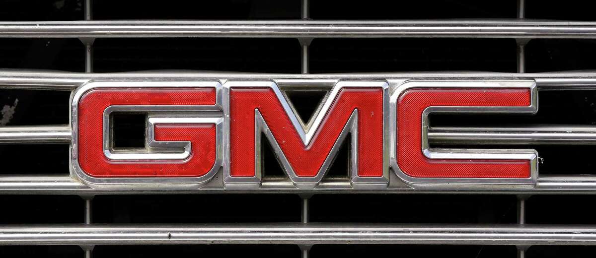 A GMC logo is seen on the grill of a pickup truck Tuesday, July 8, 2014 in Pembroke, Mass.
