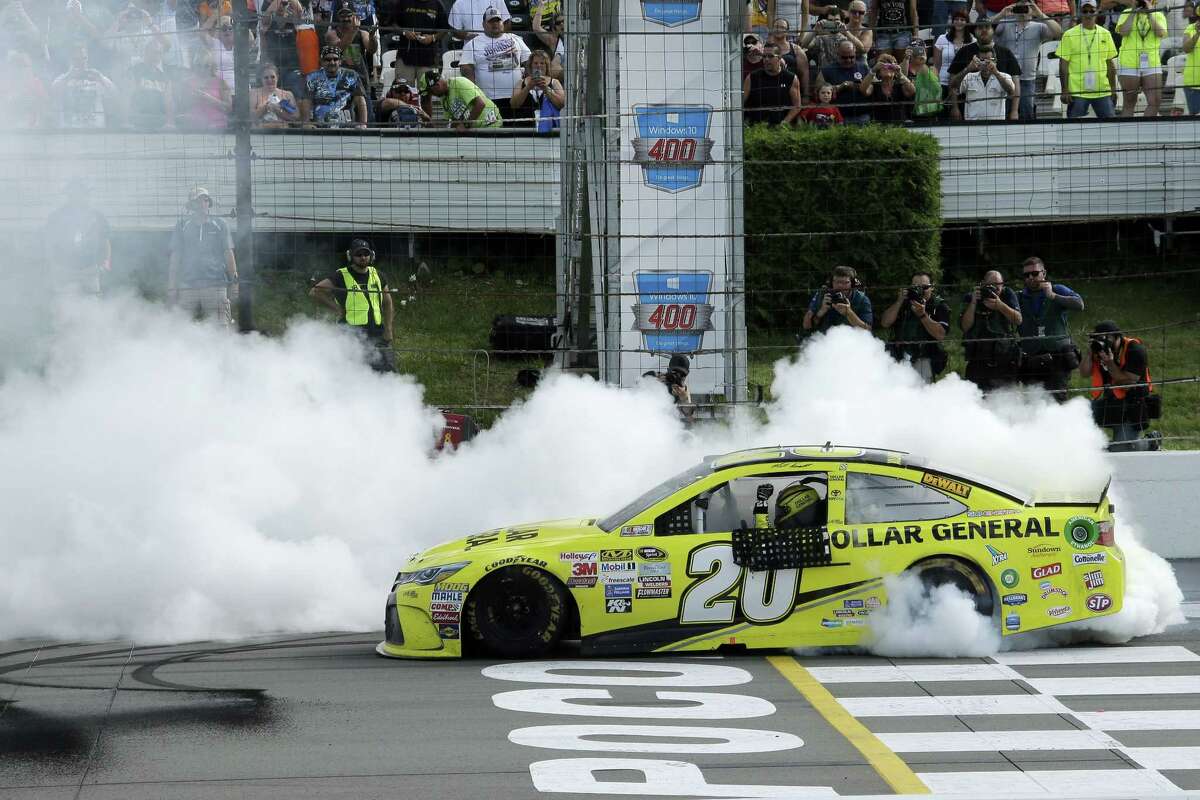 Matt Kenseth smokes his tires after winning the NASCAR Pocono 400 Sunday in Long Pond, Pa.