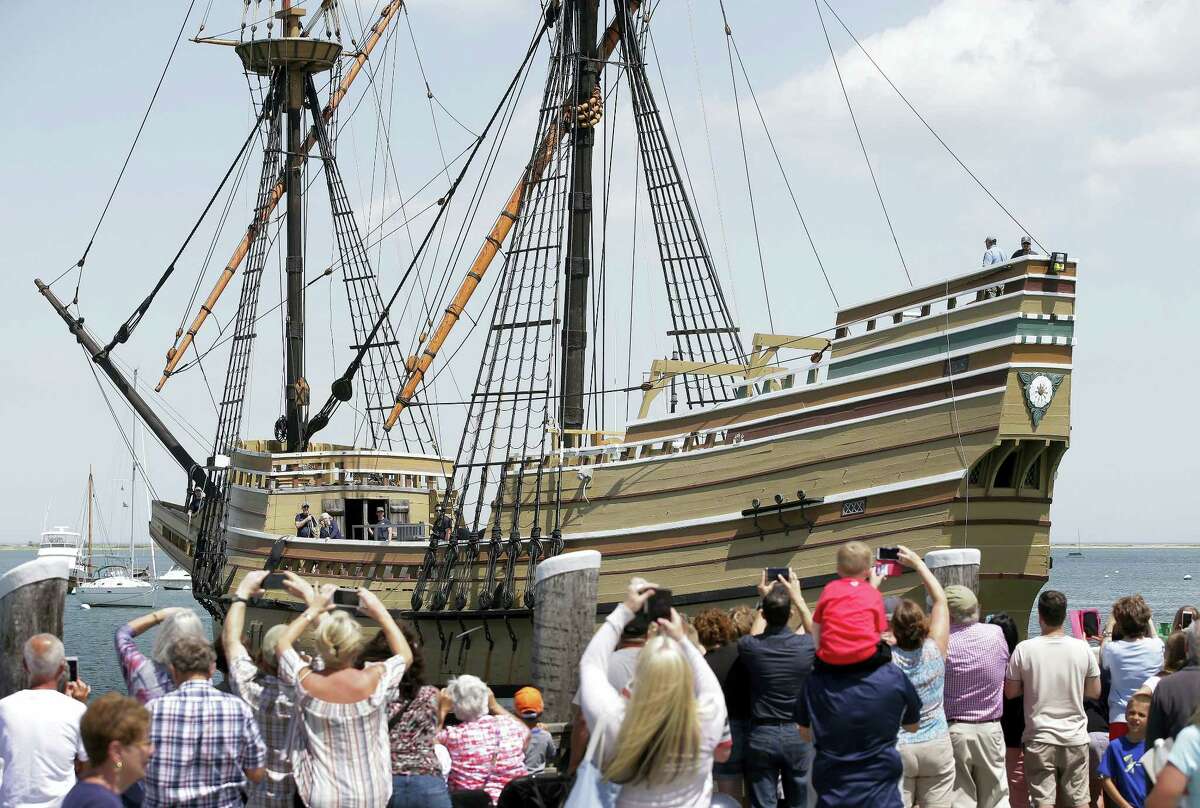 In this June 6, 2016, file photo, people on a wharf watch as the Mayflower II arrives in Plymouth Harbor in Plymouth, Mass. The 60-year-old replica of the ship that carried the Pilgrims to Massachusetts in 1620 was being towed Tuesday, Nov. 1, 2016, to Mystic, Conn., for major reconstruction that’s expected to take 2Â½ years.