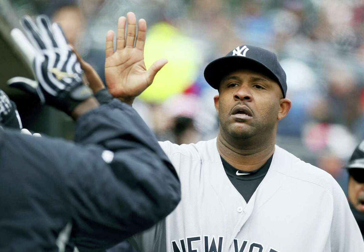 New York Yankees' CC Sabathia is congratulated in the dugout after being pulled from a baseball game against the Detroit Tigers during the seventh inning Saturday, April 9, 2016, in Detroit. (AP Photo/Duane Burleson)