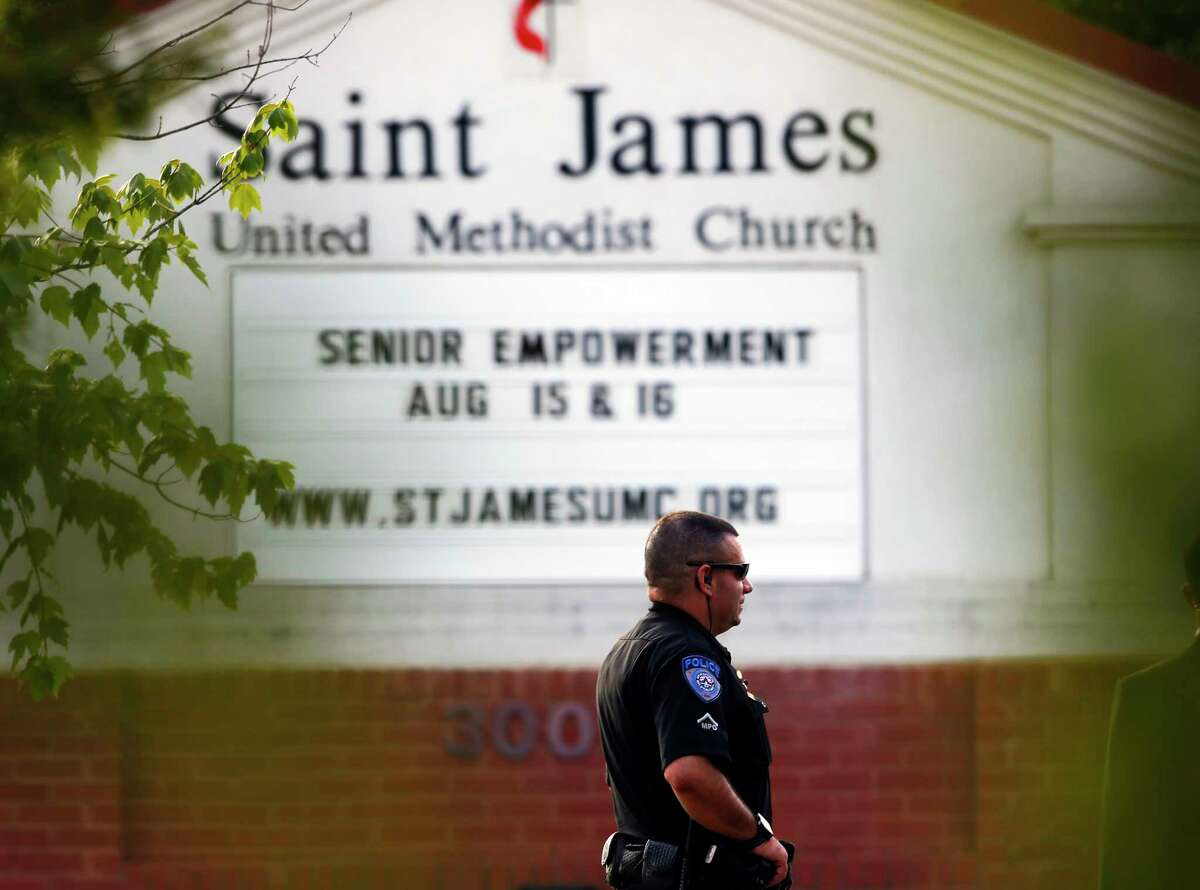 A police officer stands guard at the entrance to St. James United Methodist Church, where funeral services for Bobbi Kristina Brown took place Saturday in Alpharetta, Ga. Brown, the only child of Whitney Houston and R&B singer Bobby Brown, died in hospice care July 26, about six months after she was found face-down and unresponsive in a bathtub in her suburban Atlanta townhome.