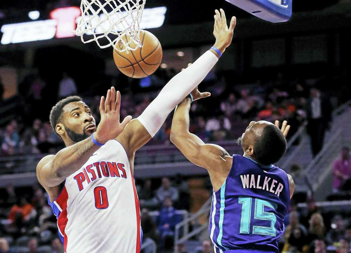 Pistons center Andre Drummond (0) blocks a shot by Hornets guard Kemba Walker during a game last season.