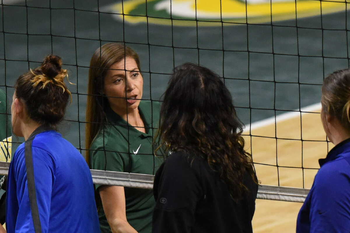 Midland College volleyball head coach Tammie Jimenez shakes hands with Western Texas College players and staff after a win Aug. 26, 2017, at Chaparral Center. James Durbin/Reporter-Telegram