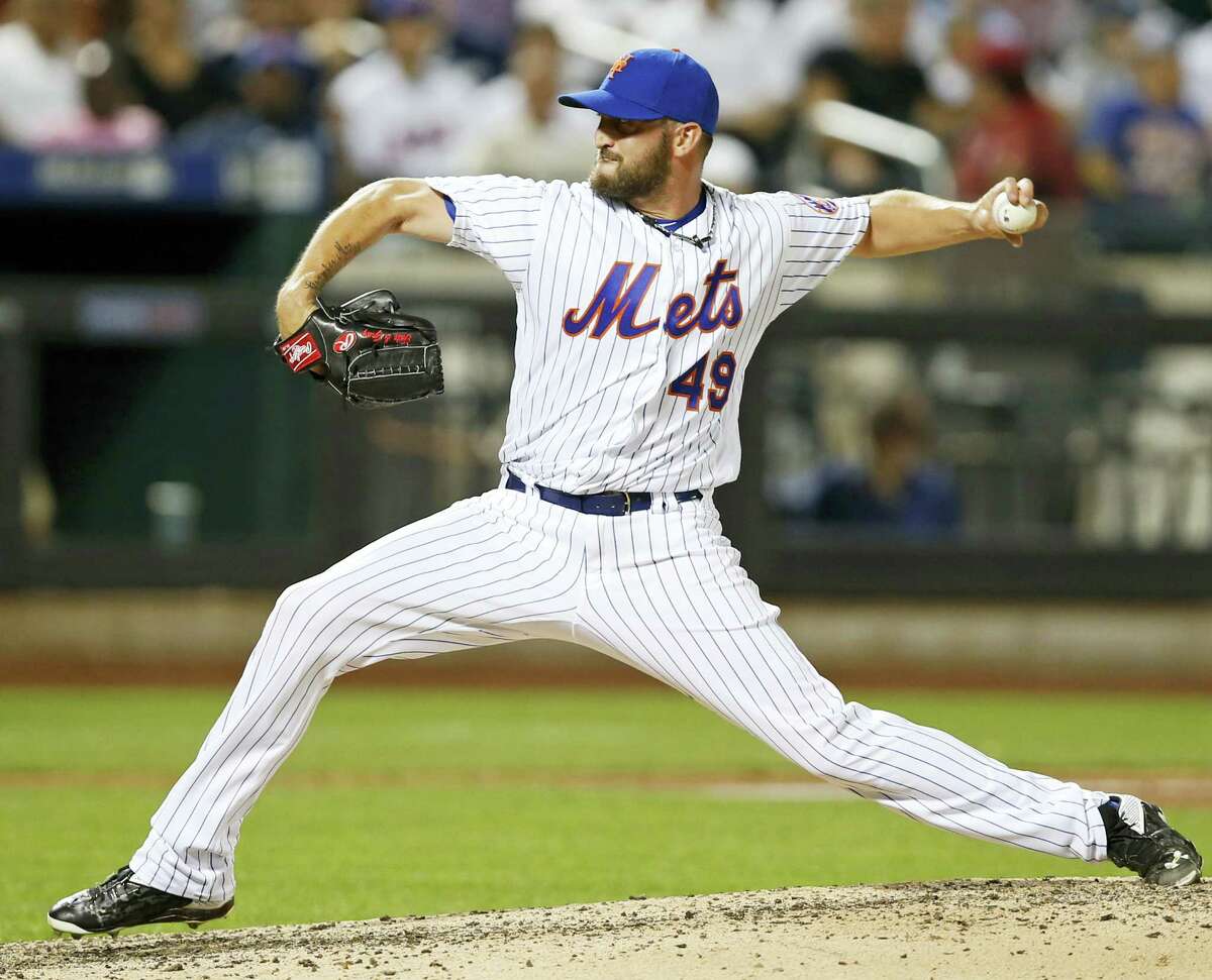 New York Mets relief pitcher Jonathon Niese winds up in the ninth inning against the New York Yankees Tuesday in New York. The Mets won 7-1.