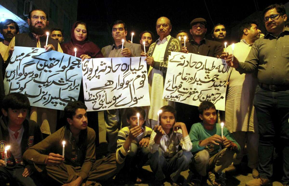 Members of a civil society group hold candles during a vigil for the victims of a plane crash, in Multan, Pakistan, Wednesday, Dec. 7, 2016. Pakistan’s national carrier said the plane crashed shortly after takeoff from the northern city of Chitral with 48 people aboard. A spokesman for the Interior Ministry said there were no survivors. Rescuers told The Associated Press that the victims’ bodies were beyond recognition.